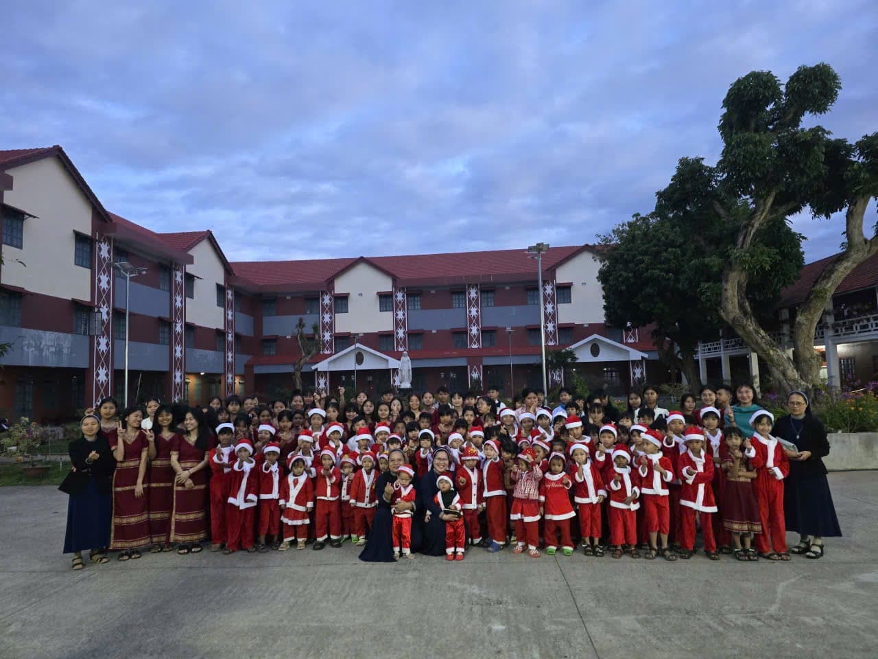 Children and religious sisters gathered for their 2025 Christmas celebration