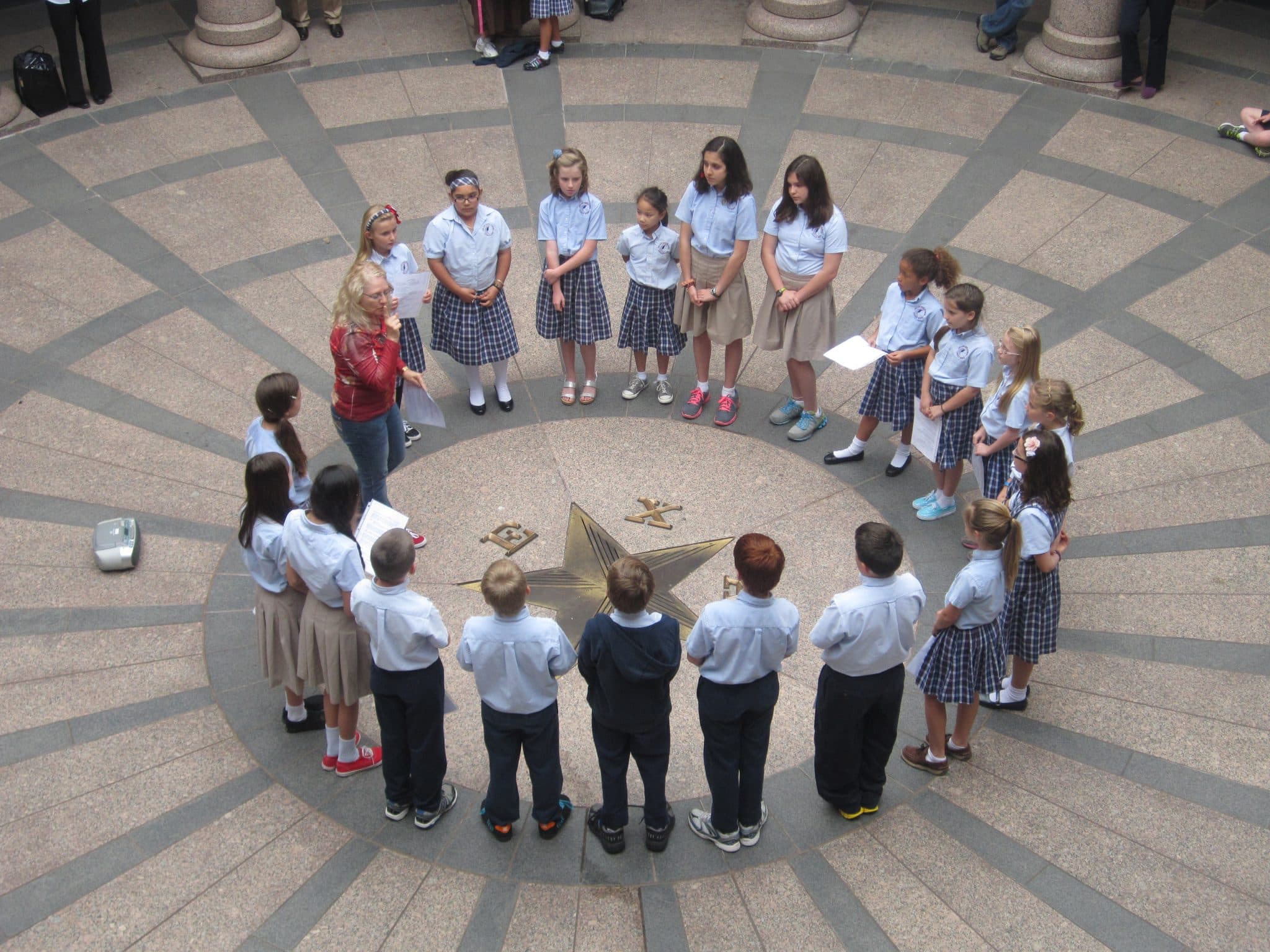 Loves Gate parish youth choir singing in the Texas State Capitol rotunda